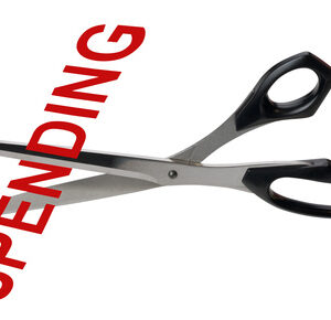 One Debt | Take The First Step | Scissors-cutting-the-word-Spending